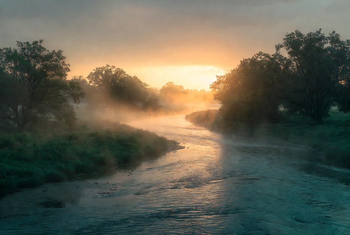 Morning mist over the flowing river